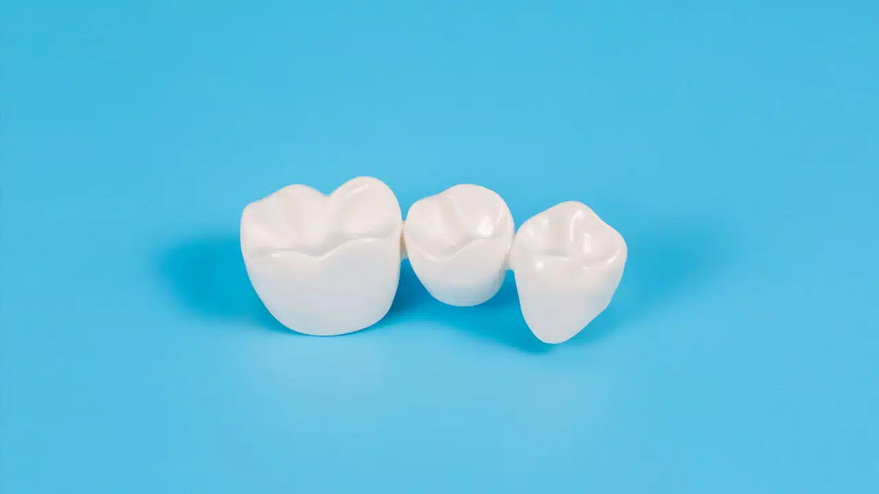Dental crowns on a blue background